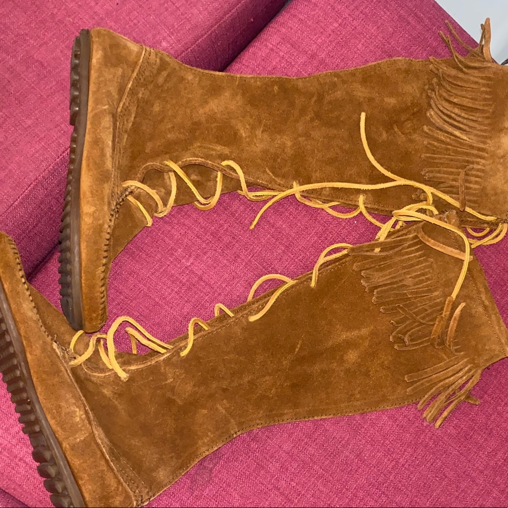 Tall tan moccasin tie up boots